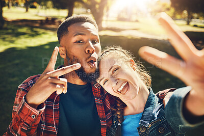 Buy stock photo Couple smile, selfie peace sign and portrait outdoors, laughing at funny joke and bonding in nature. Diversity, love romance and black man and woman with v hand emoji to take photo for happy memory.