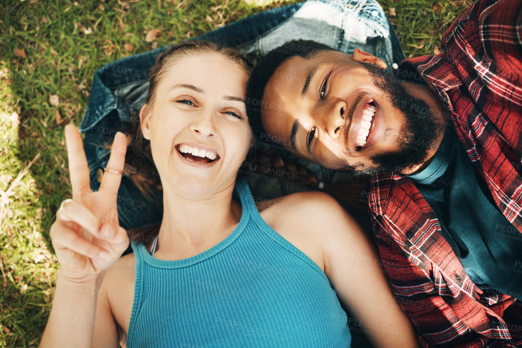 Buy stock photo Interracial couple, park and portrait selfie for lying, relax or grass for smile, love or happiness on holiday. Black man, woman or profile picture on lawn for social media for romance, above or care