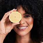 Portrait face, hair care and black woman with lemon in studio isolated on a brown background. Fruit, skincare and happy female model with lemons for healthy diet, nutrition or vitamin c and minerals.