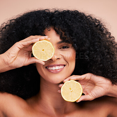 Buy stock photo Face portrait, hair care and black woman with lemon in studio isolated on a brown background. Fruit, skincare and happy female model with lemons for healthy diet, nutrition or vitamin c and minerals.