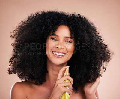 Buy stock photo Model, portrait or afro hair product on isolated studio background in frizz control, curly management or oil treatment. Happy black woman, face or natural haircare spray in texture wellness grooming