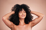 Hair care, beauty and black woman face in studio for shampoo growth and shine. Aesthetic model with natural curly afro for luxury cosmetics, facial skincare and makeup glow on gradient background