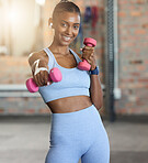 Woman, fitness and portrait smile with dumbbells for weightlifting exercise, workout or strength training at gym. Happy female smiling for lightweights, exercising or healthy wellness at health club