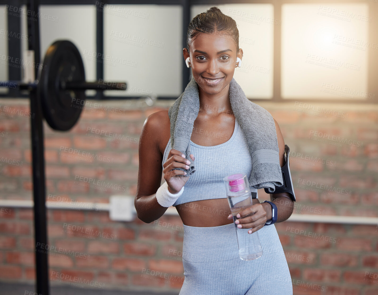 Buy stock photo Woman, fitness and portrait smile with water bottle and sweat towel for exercise, workout or training at gym. Happy female smiling with drink for refreshment, hydration or healthy cardio wellness