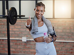 Woman, fitness and portrait smile with thumbs up for good job, workout success or thank you with water bottle at gym. Happy sporty female smiling showing thumb up emoji, yes sign or like for exercise