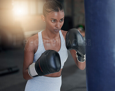 Buy stock photo Fight, black woman and boxing for fitness, focus and motivation for exercise, workout or wellness. Boxer, female athlete and confident lady in gym, fist gloves and determined with endurance or energy