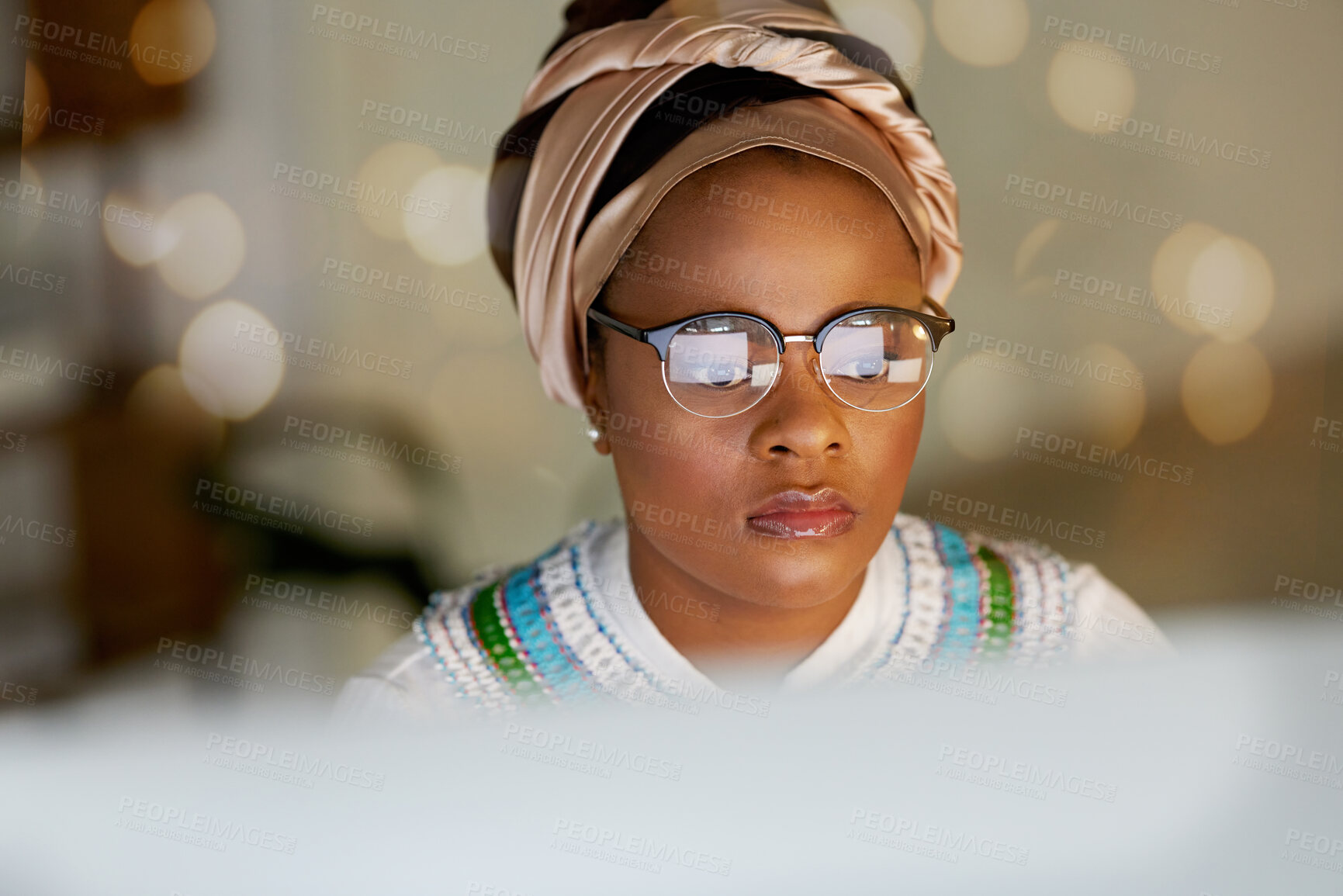 Buy stock photo Black woman, face and reading on computer screen, focus and working, editor and research with bokeh overlay. Female in office, review and data analysis with check article for blog or read email