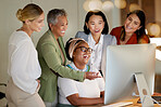 Collaboration, laughter and a business manager with her team, working on a computer in the office at night. Teamwork, diversity and coaching with a senior woman manager training her staff at work