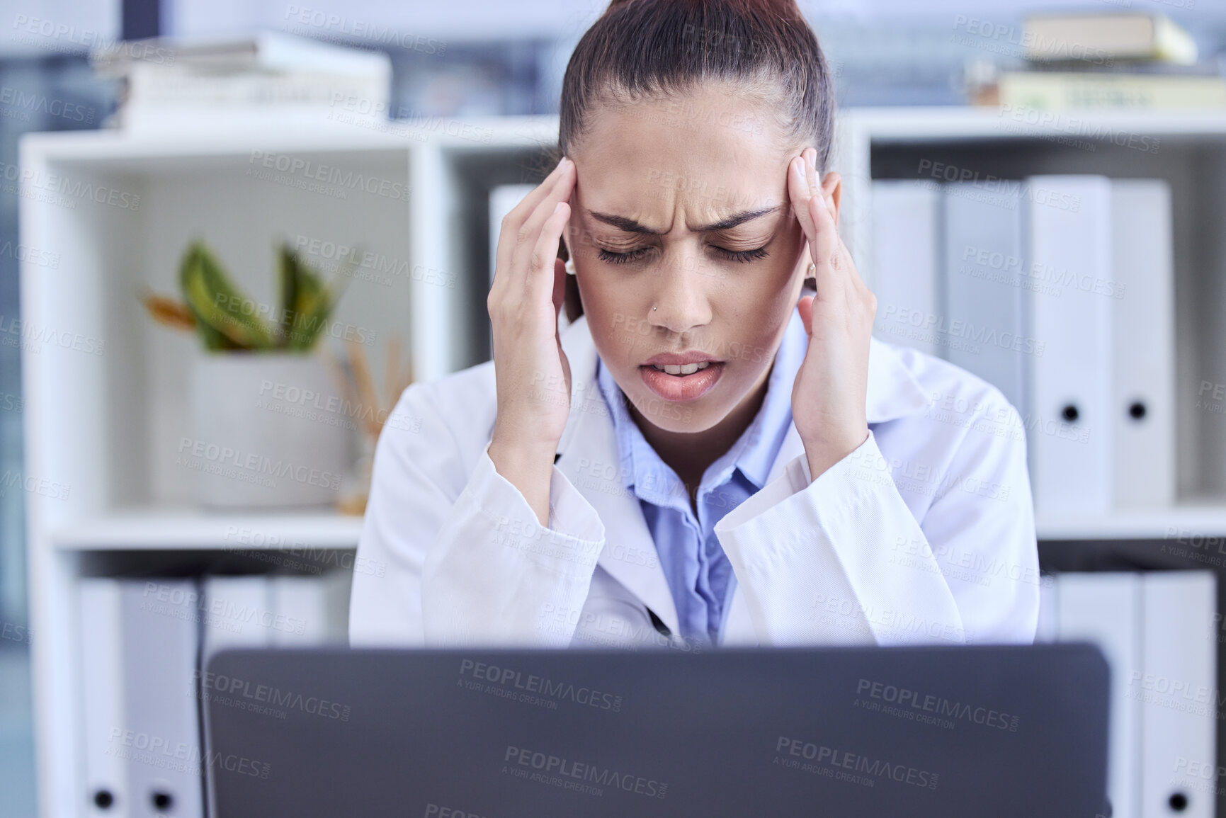 Buy stock photo Burnout, stress and doctor with a headache from a laptop, healthcare anxiety and depression. Medicine, angry and nursing woman with a migraine, mental health problem and tired from an email online