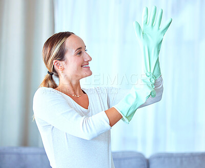 Buy stock photo Woman, gloves and cleaning for hygiene, disinfectant and cleaner ready to start the day, housekeeping and sanitary. Female, lady and maid in living room, dust and dirt with bacteria and rubber safety