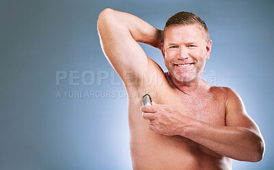 Buy stock photo Man, portrait smile and shaving armpit in skincare hygiene or grooming against a studio background. Elderly male model smiling in satisfaction for arm shave, hair removal or clean cosmetics on mockup
