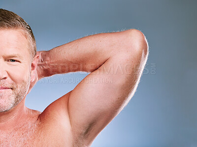 Buy stock photo Portrait, skincare and armpit with a mature man in studio on a gray background for hygiene or grooming. Face, beauty and underarm with a male posing to promote body care, wellness or fitness