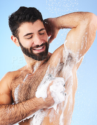 Buy stock photo Wellness, man and foam for cleaning, morning routine for hygiene, grooming and daily washing on blue studio background. Male, guy or drops of aqua, showering for freshness, luxury or soap on backdrop