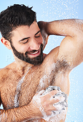 Buy stock photo Showering, man and foam with arm pit, cleaning and skincare for dermatology and wet body against blue studio background. Male, gentleman and morning routine for daily hygiene and grooming on backdrop
