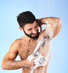Skincare, man and foam with water, cleaning and showering for wellness and hygiene against blue studio background. Male, gentleman and washing for morning routine, daily and dermatology on backdrop
