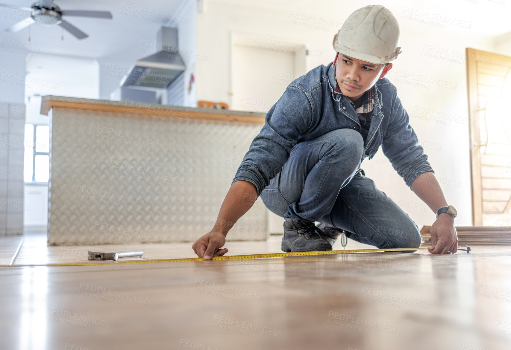 Buy stock photo Man, carpenter and measure floor with tape, home interior and buildings maintenance. Builder, construction and handyman measuring flooring on ground, wood board house and property renovation tools 