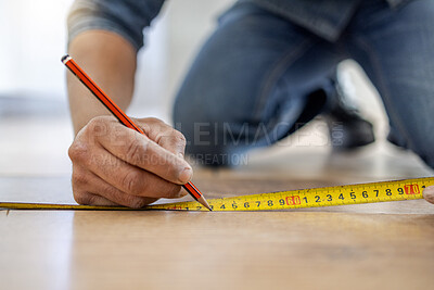 Buy stock photo Handyman, floor and hands to measure with pencil, tape and diy for home improvement, maintenance and building. Builder, construction worker and flooring with writing, planning and vision in workplace