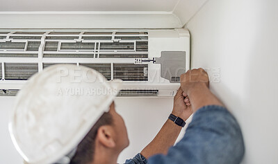 Air conditioner, ac repair and maintenance of a handyman and builder working on home renovation. Electric technician, service worker and contractor in a house for equipment installation on wall