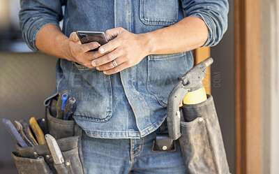 Buy stock photo Closeup, hands and man with smartphone, maintenance and research for instructions, deadline or schedule. Zoom, male or handyman with cellphone, social media or typing for connection or search on site