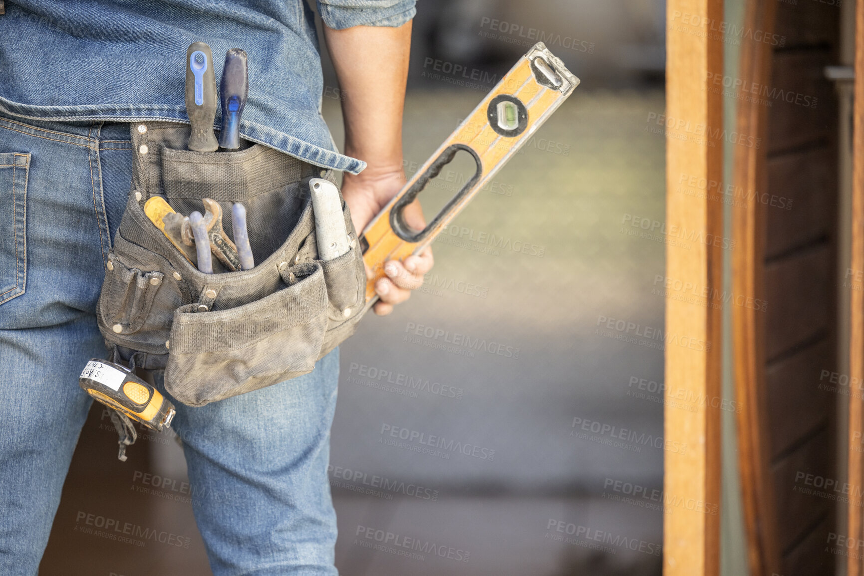 Buy stock photo Maintenance man, bag and tools with hands, front door and home improvement service in property industry. Construction worker, back and jeans for working at house, building or real estate development