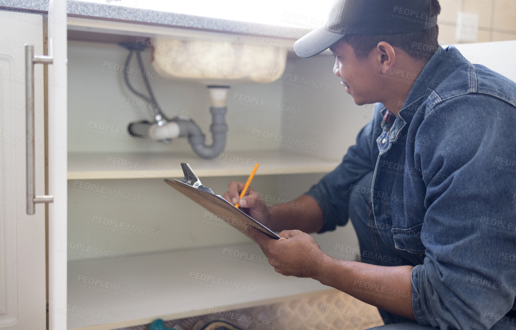 Buy stock photo Plumber, sink maintenance document and plumbing check of a handyman in a kitchen. Water pipe installation, home repair checklist and builder in a household for building construction and inspection