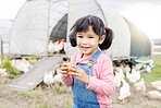 Girl child portrait, chicken farm and egg with smile, learning or organic agriculture startup in spring. Kid, poultry bird farming and sustainability in countryside, summer or morning for animal care