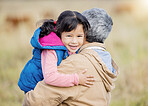 Hug, happy and portrait of a child with grandmother on a farm for bonding, playing and walking. Smile, affection and girl hugging a senior person while on a walk in the countryside for quality time