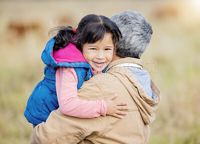 Buy stock photo Hug, happy and portrait of a child with grandmother on a farm for bonding, playing and walking. Smile, affection and girl hugging a senior person while on a walk in the countryside for quality time