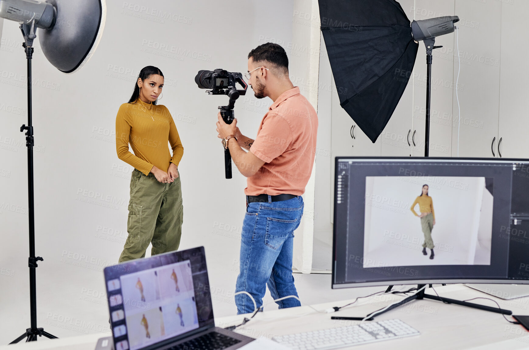 Buy stock photo Photography, shooting and photographer with woman fashion model in studio for creative, advertising and image. Media, backstage and profession man videographer with girl and equipment for photoshoot