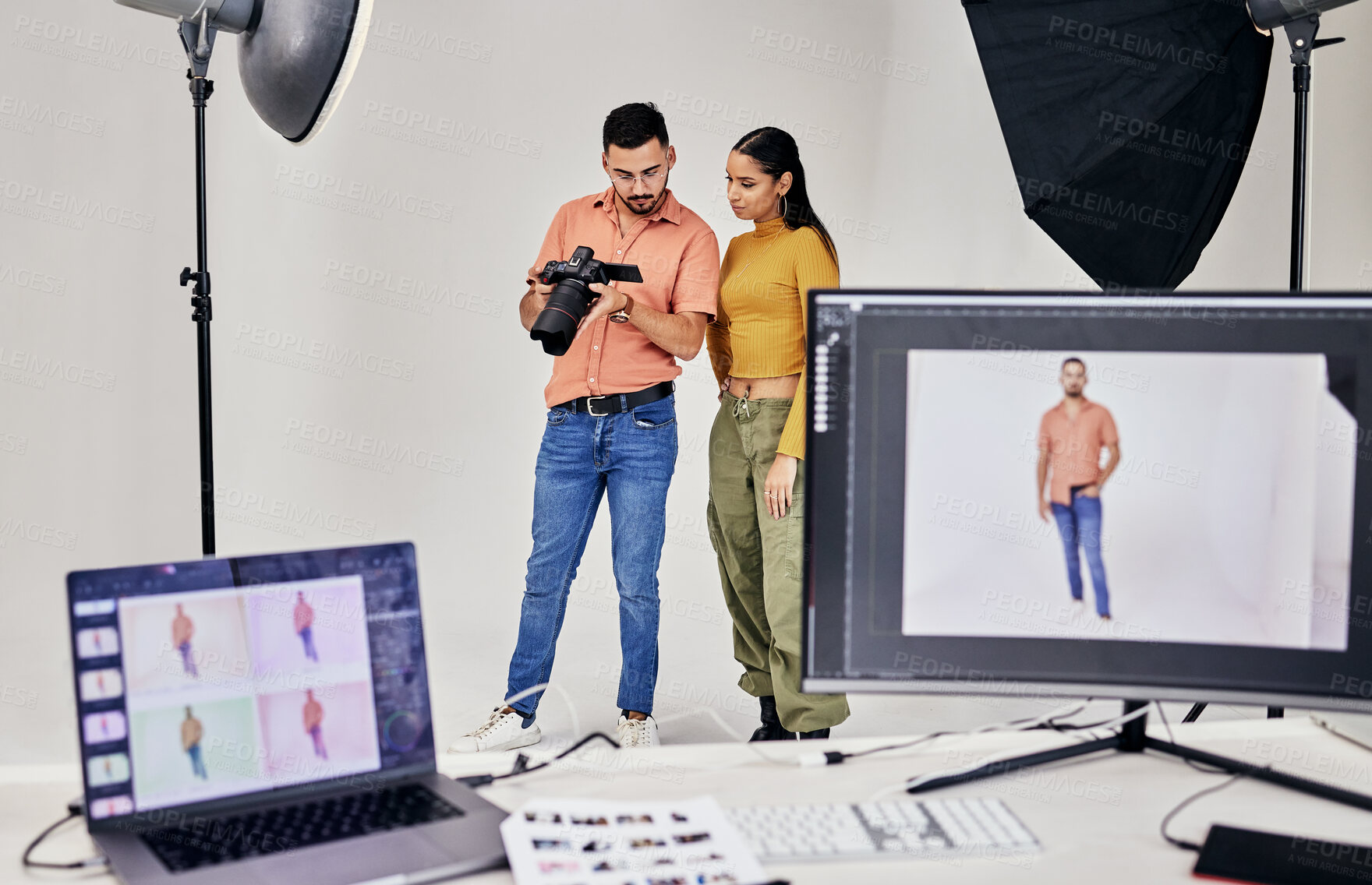 Buy stock photo Collaboration, photographer and startup people in studio set with camera for shoot, magazine project or online content. Planning or teamwork examine picture for digital catalog or fashion web design 