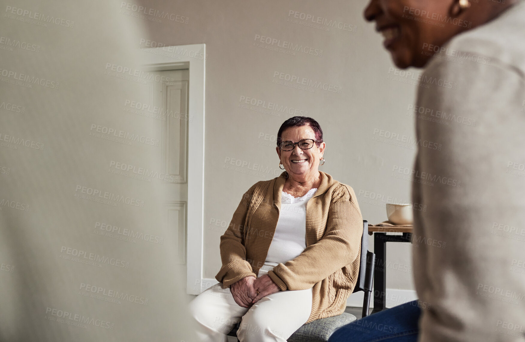 Buy stock photo Mental health, group therapy and senior woman with smile at meeting for discussion on help and support in retirement. Trust, compassion and empathy, women with therapist for sharing in nursing home.