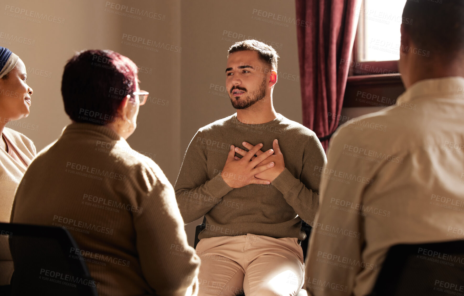 Buy stock photo Support, trust and man sharing in group therapy with understanding, feelings and talking in session. Mental health, addiction or depression, men and women with therapist sitting together for healing.