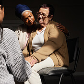Support, holding hands and senior woman in group therapy with women ...