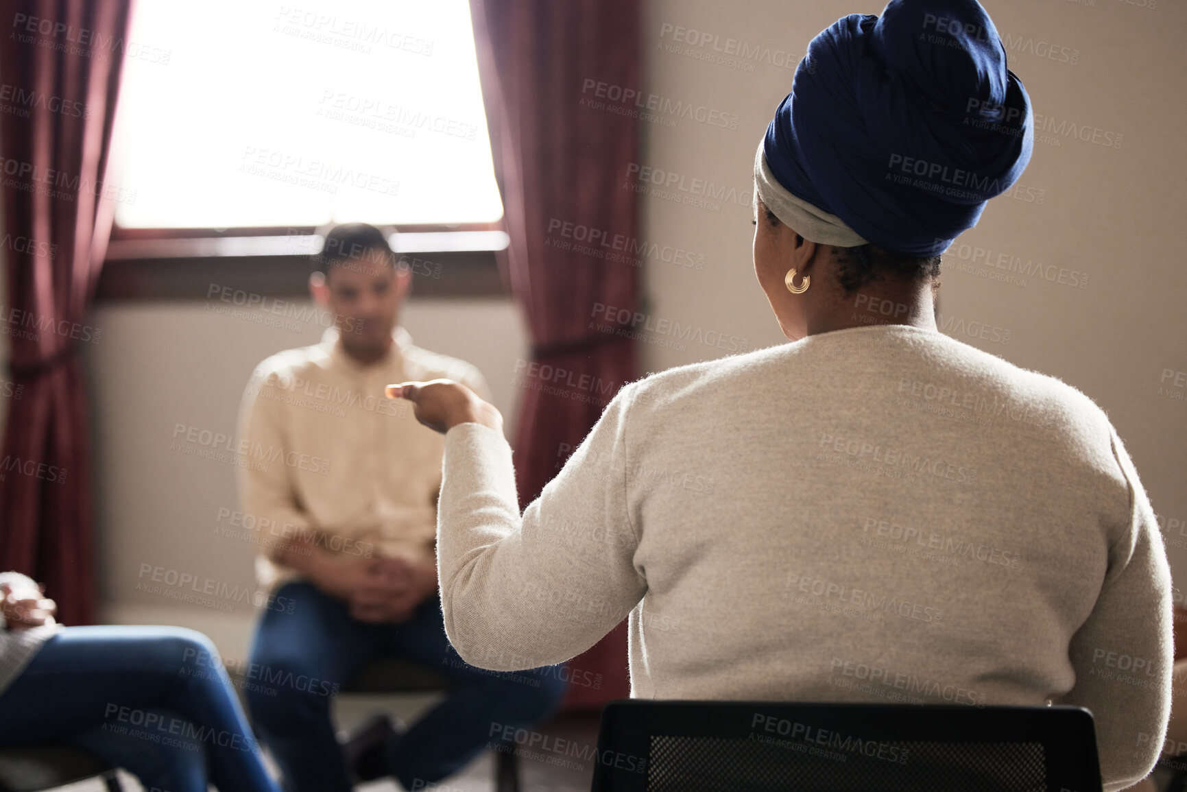 Buy stock photo Support, black woman and group of people in therapy with understanding, sharing feelings and talking in session. Mental health, addiction or depression, men and women with therapist sitting together.