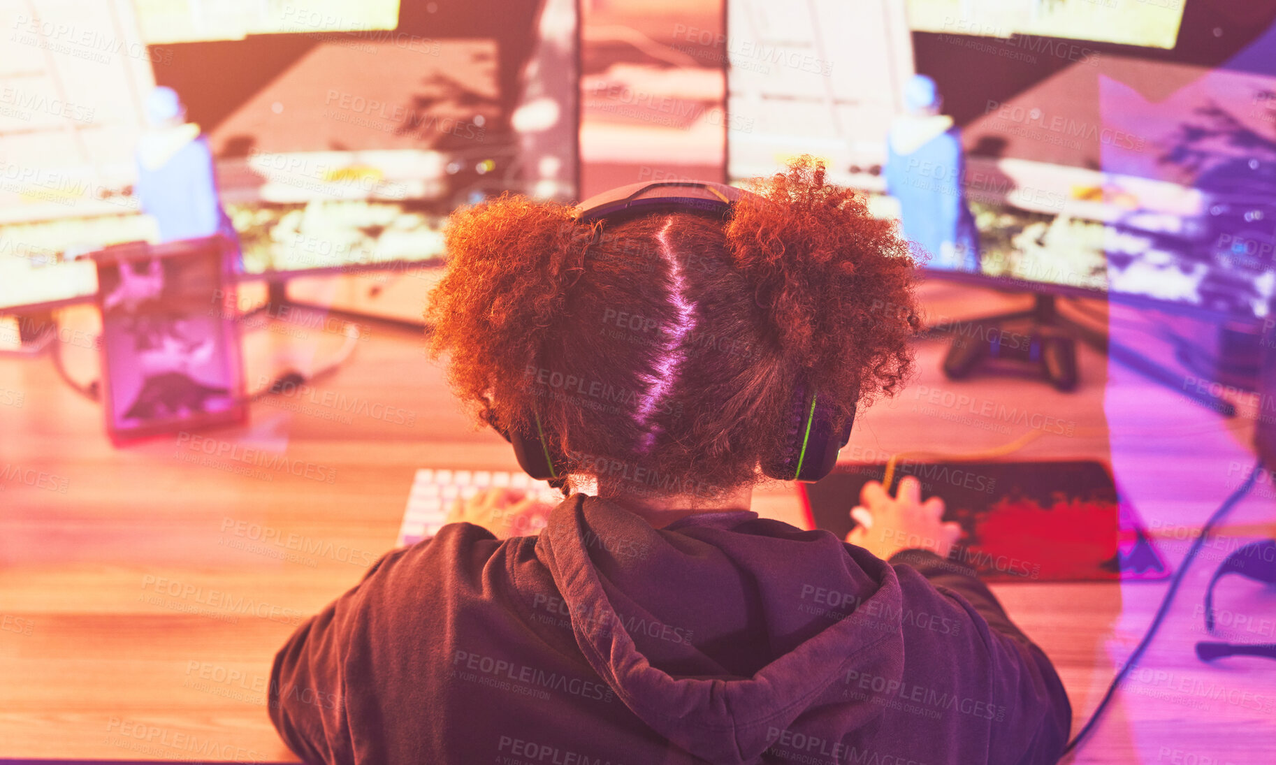 Buy stock photo Back of girl, streamer and video game on computer in home, desk or online games of virtual competition. Female gamer, live streaming and gaming with headphones in neon lighting, esports tech or gen z