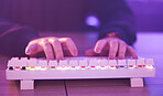 Gaming, keyboard and hands of a person typing for the internet, connection and communication. Cyber, email and gamer with technology for an online competition, game and challenge while streaming