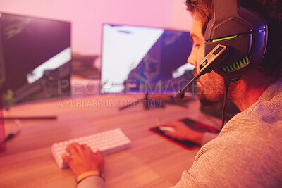 Buy stock photo Computer gaming, man and esports player with headphones, video games and virtual competition in dark. Gamer guy, online challenge and headset of live streaming in neon lighting, tech and rpg streamer