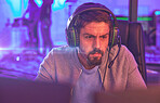 Video game, focus man and esports of online games, virtual competition and face in dark room. Gamer guy, online gaming and live streaming on headset in neon lighting, tech and cyber streamer at night