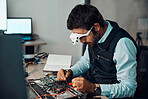 Technician, computer and engineer repair motherboard, microcircuit or electronic device in a workshop or shop. Person, man and guy fixing hardware with electric meter for technology in a lab