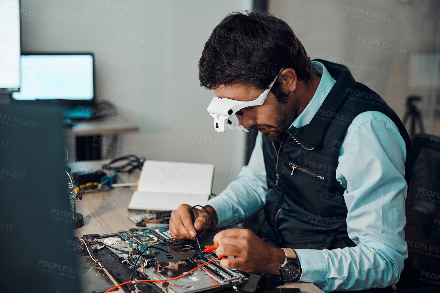 Buy stock photo Technician, computer and engineer repair motherboard, microcircuit or electronic device in a workshop or shop. Person, man and guy fixing hardware with electric meter for technology in a lab