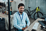 Man, portrait and IT technician in an office for computer software, technology or problem solving at desk. Happy engineer person doing maintenance, programming and digital development project