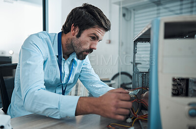 Buy stock photo Serious man, it or technician fixing computer, PC or processor in engineering service workshop. Worker, CPU or hardware for repair, maintenance or software upgrade in information technology industry