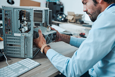 Buy stock photo Engineering, technician and man fixing the hardware of a computer in workshop or office. IT, technology and male professional doing maintenance or repairs on microcircuit or motherboard in workplace.