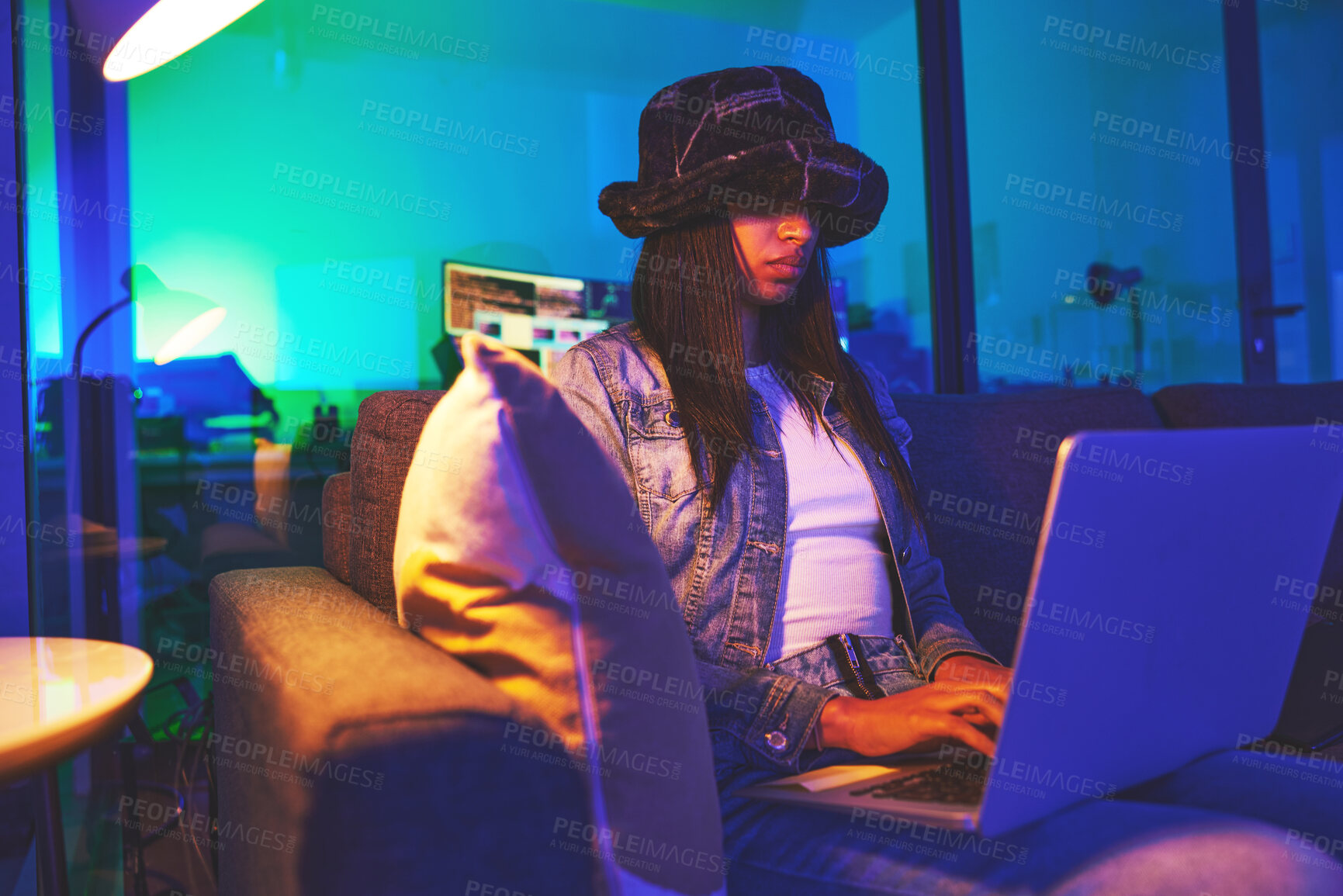 Buy stock photo Programmer, hacker and woman typing on laptop in home at night in neon light to hack software. Cybersecurity, ransomware phishing and female coder coding on computer for hacking database with malware