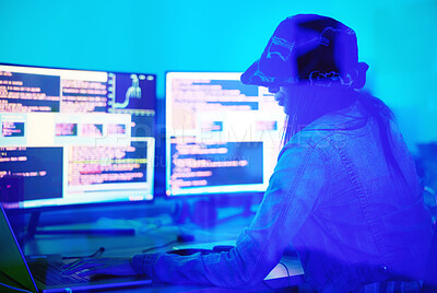 Buy stock photo Hacker, programmer and woman typing on laptop in home at night in neon light to hack software. Cybersecurity, ransomware phishing and female coder coding on computer for hacking database with malware