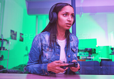 Buy stock photo Gamer, headphones and woman in home at night in neon light for web esports. Gaming, cyber technology and gen z female with controller playing online games, video game or multiplayer app on internet.