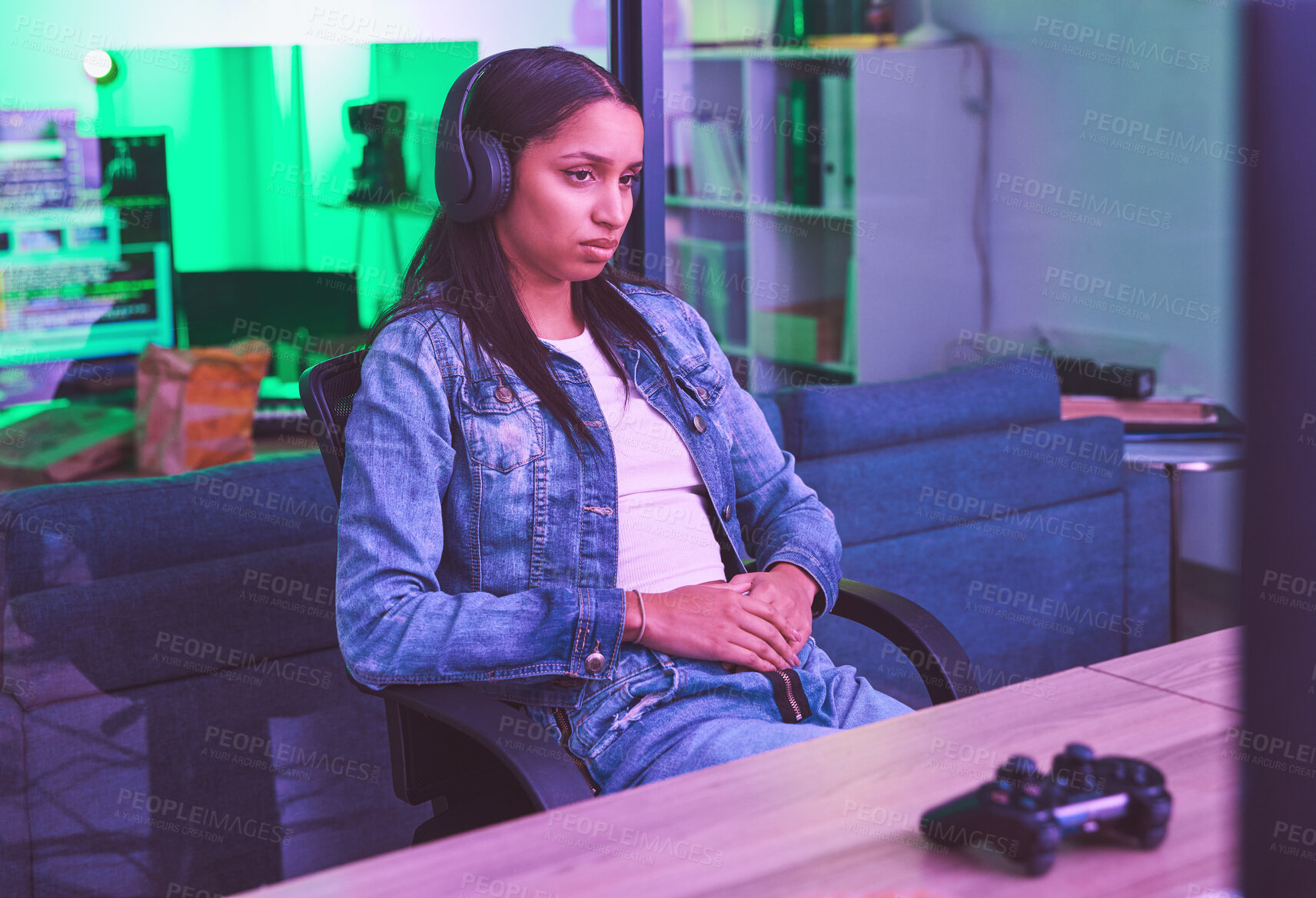 Buy stock photo Woman, headphones or gaming loss in neon home with bored, tired or annoyed face expression in PC esports challenge. Video gamer, console or loser in night house basement with fail, mistake or burnout