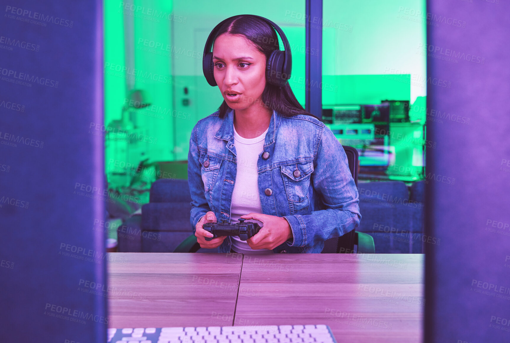 Buy stock photo Headphones, gamer and woman on computer in home at night in green neon light for web esports. Gaming, technology and female with controller playing online games, multiplayer or video game in house.