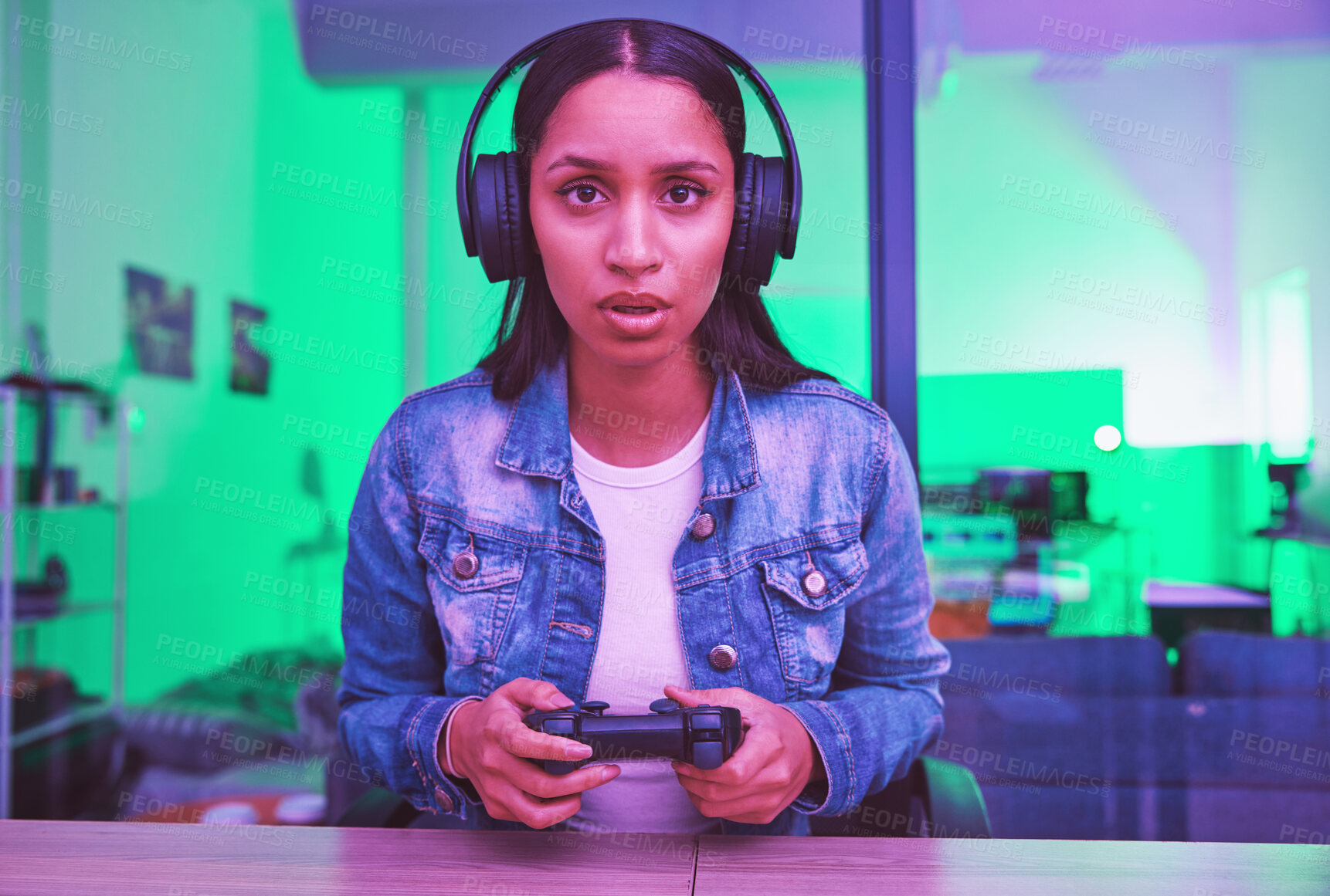Buy stock photo Gamer, headphones and portrait of woman in home at night in neon light for web esports. Gaming face, cyber technology and gen z female with controller playing online games and video game in house.