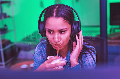 Buy stock photo Gamer, headphones and drinking in neon home with bored, tired or annoyed face of girl in PC esports gaming. Woman programmer, drink and thinking in night basement and listening to music or radio